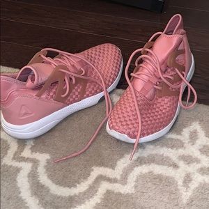 Women’s rose gold Reebok tennis shoes